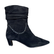 black slouchy suede pointed-toe kitten heel ankle boot on a white background