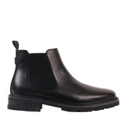 black leather chelsea boot on a white background