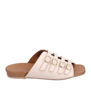 Cream slip-on sandal with strappy buckle details across vamp on a white background. 