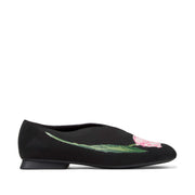 black floral ballet flats on a white background