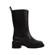 black mid-calf heeled boots on a white background