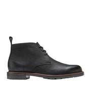 black lace-up chukka boot on a white background