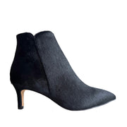 black pony hair kitten heel ankle boot on a white background