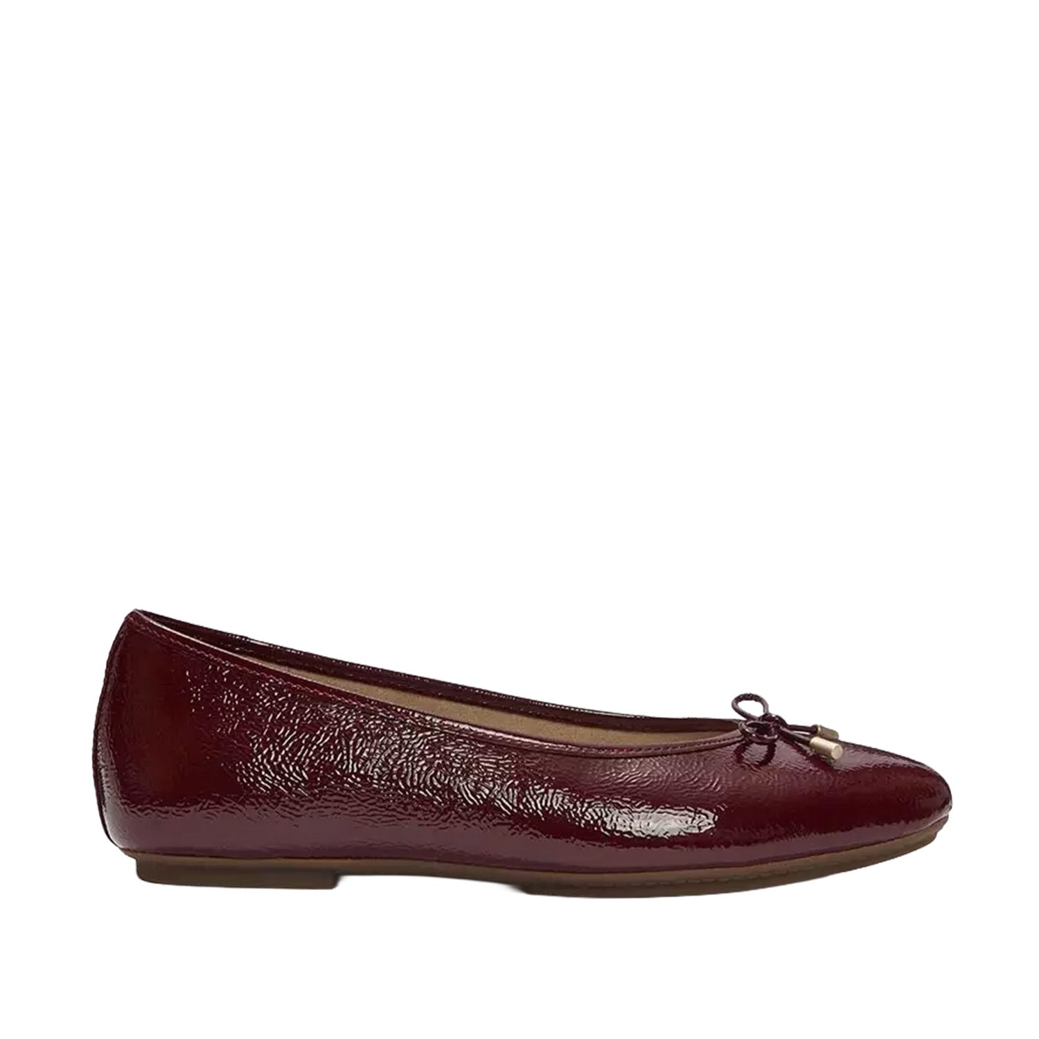 burgundy ballet flat on white background