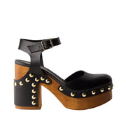 black leather studded clog sandal with a wooden platform heel on a white background