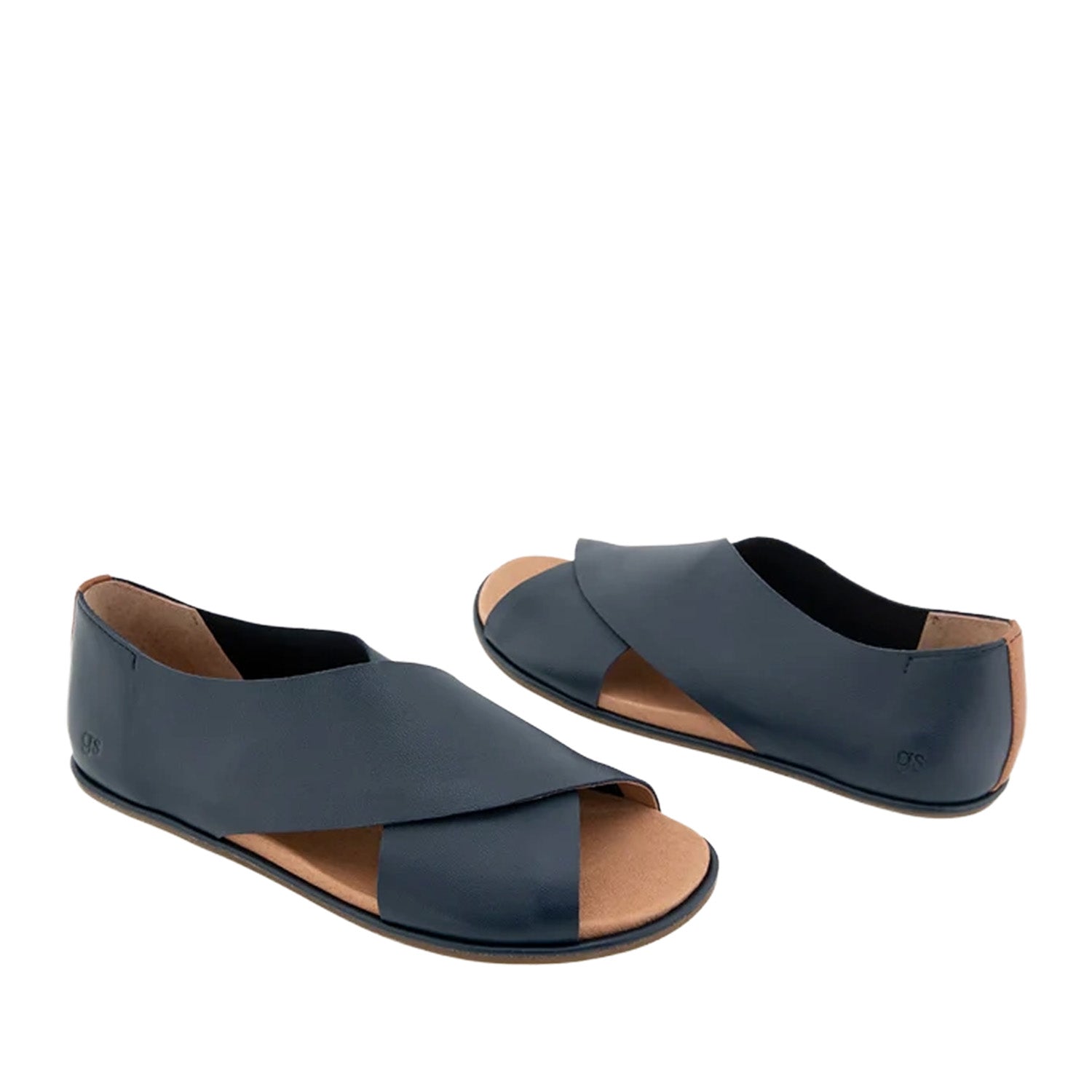 Navy blue leather flat sandal with a crossover strap and a peep-toe. 