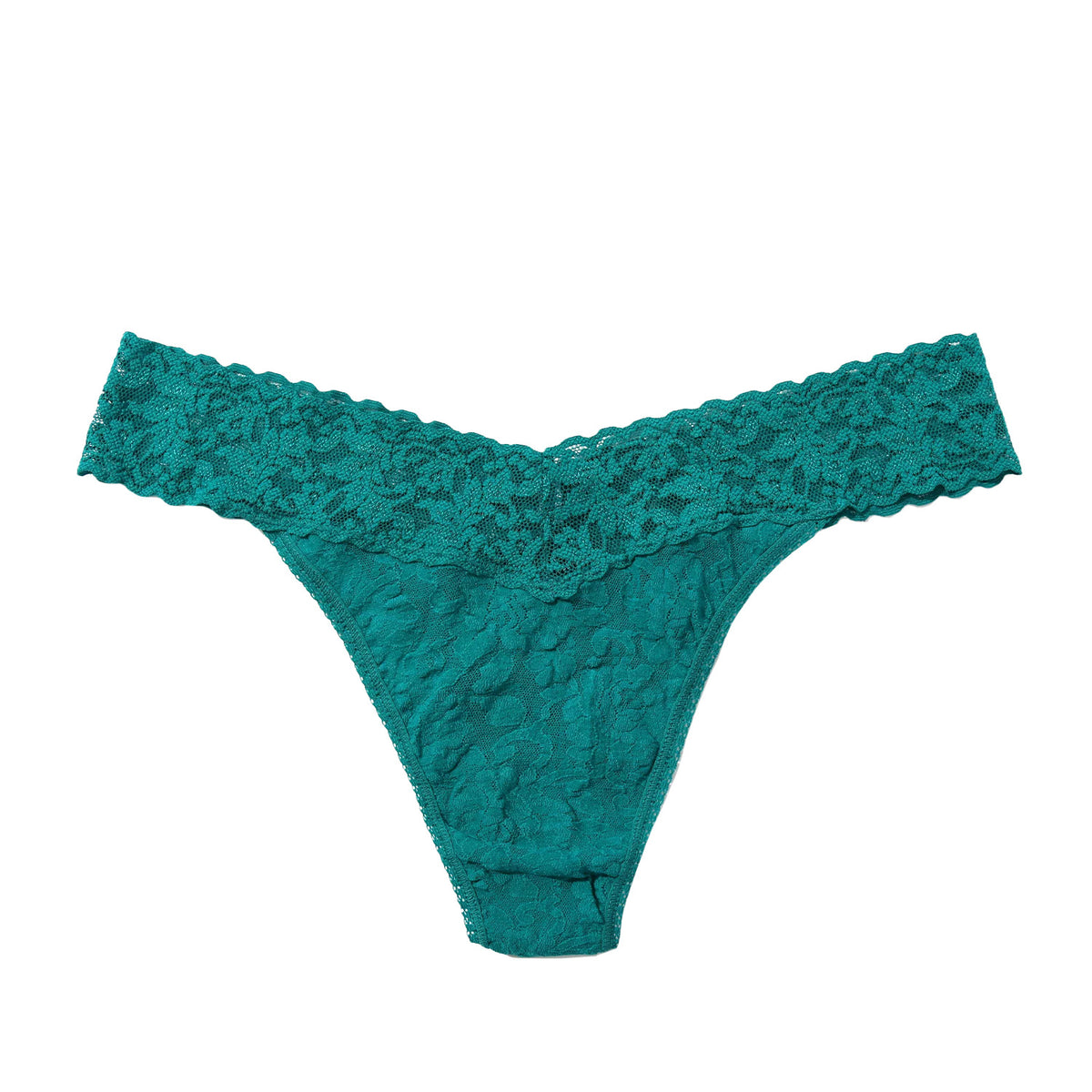 green lace thong on a white background