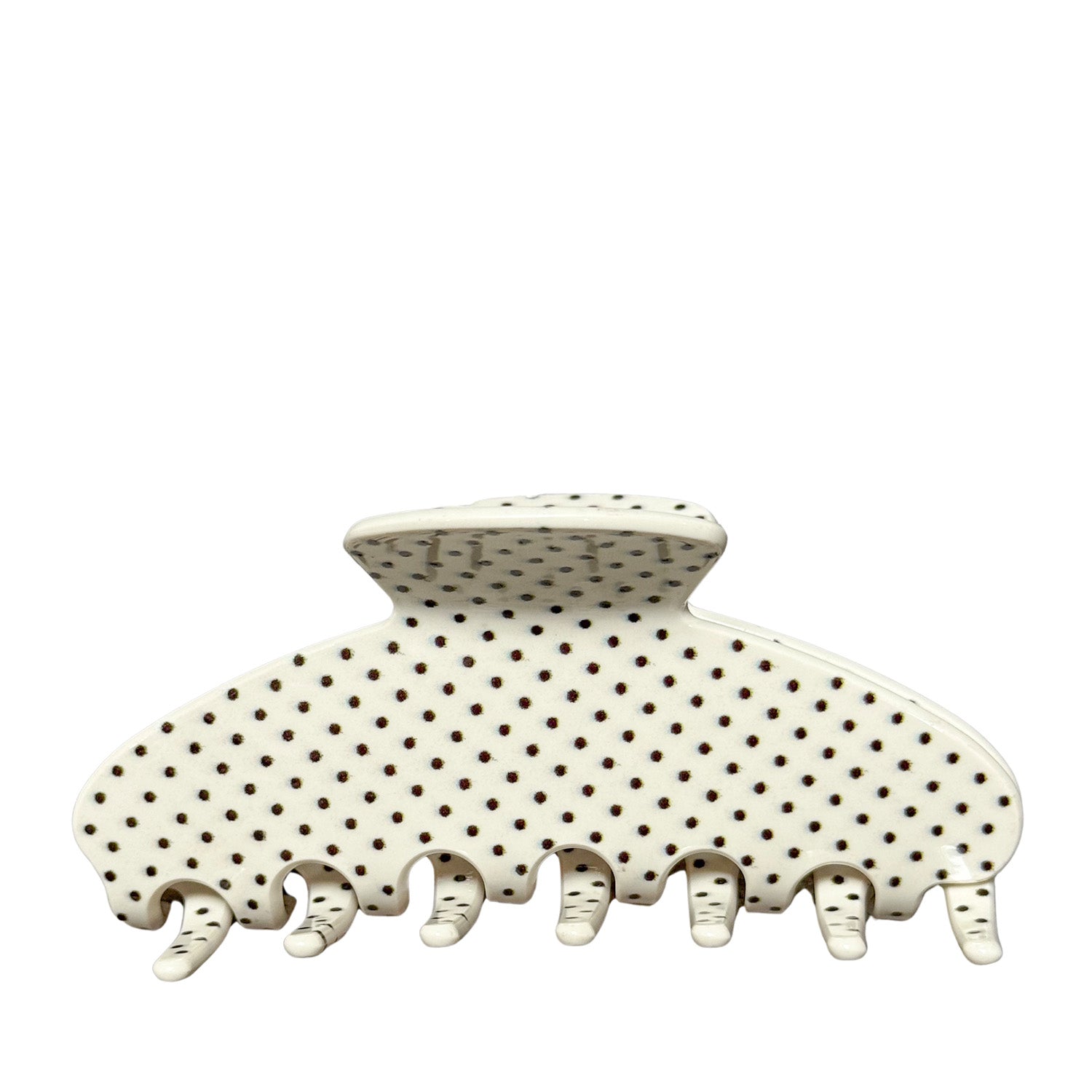 white polka dot patterned hair claw clip on a white background