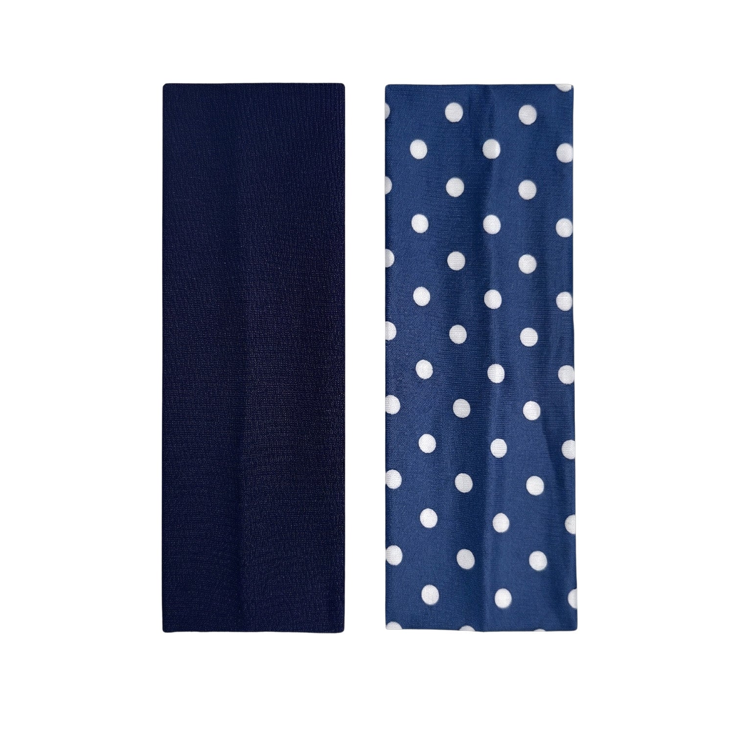 solid navy headband and navy headband with white polka dots on a white background