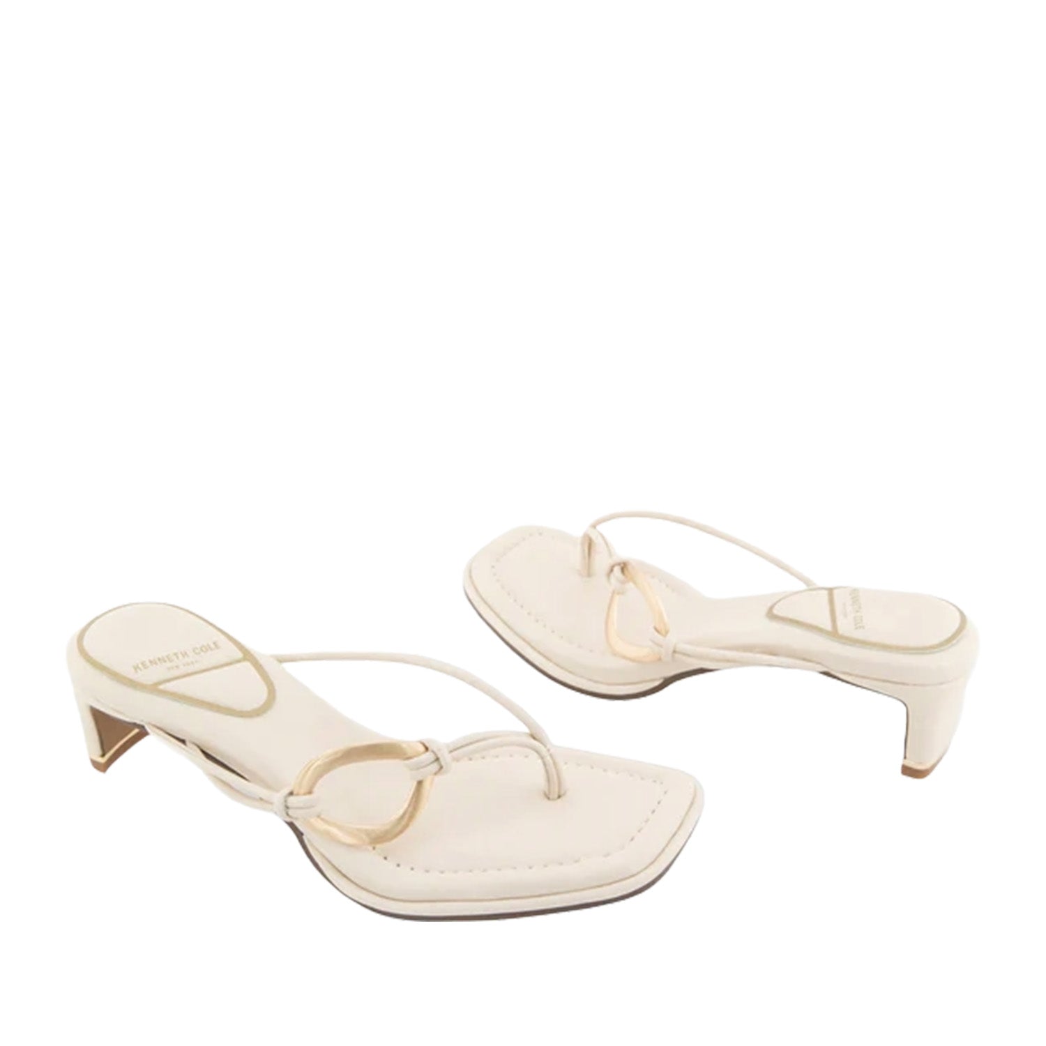 Cream toe-post kitten heel sandal with gold-tone hardware on strap