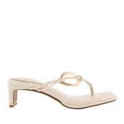 Cream toe-post kitten heel sandal with gold-tone hardware on strap