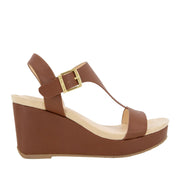 Brown leather espadrille wedge sandal with a t-strap, and ankle buckle. 