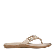 Champagne flip-flop with embellished rhinestone straps. 