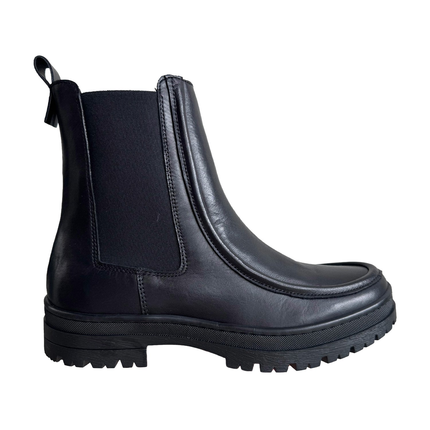 black leather chelsea ankle boot with platform lug sole on a white background