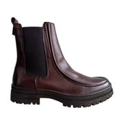 brown leather chelsea ankle boot with platform lug sole on a white background