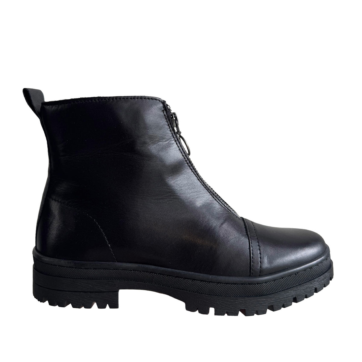 black front-zip ankle boot with chunky lug sole on a white background