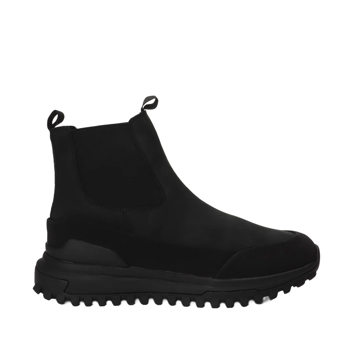 black leather chelsea winter boot with lug sole on a white background
