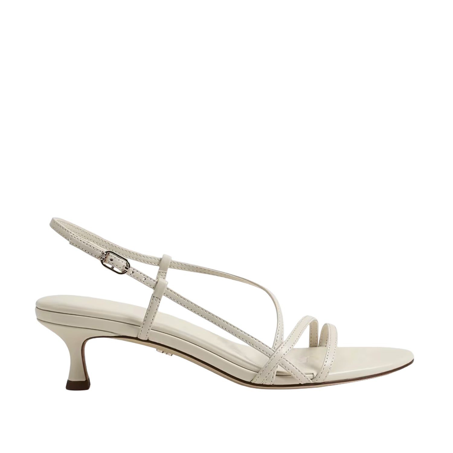 White slingback strappy kitten heel sandal on a white background.