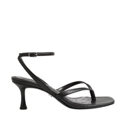 Black heeled sandal with a toe-post on a white background