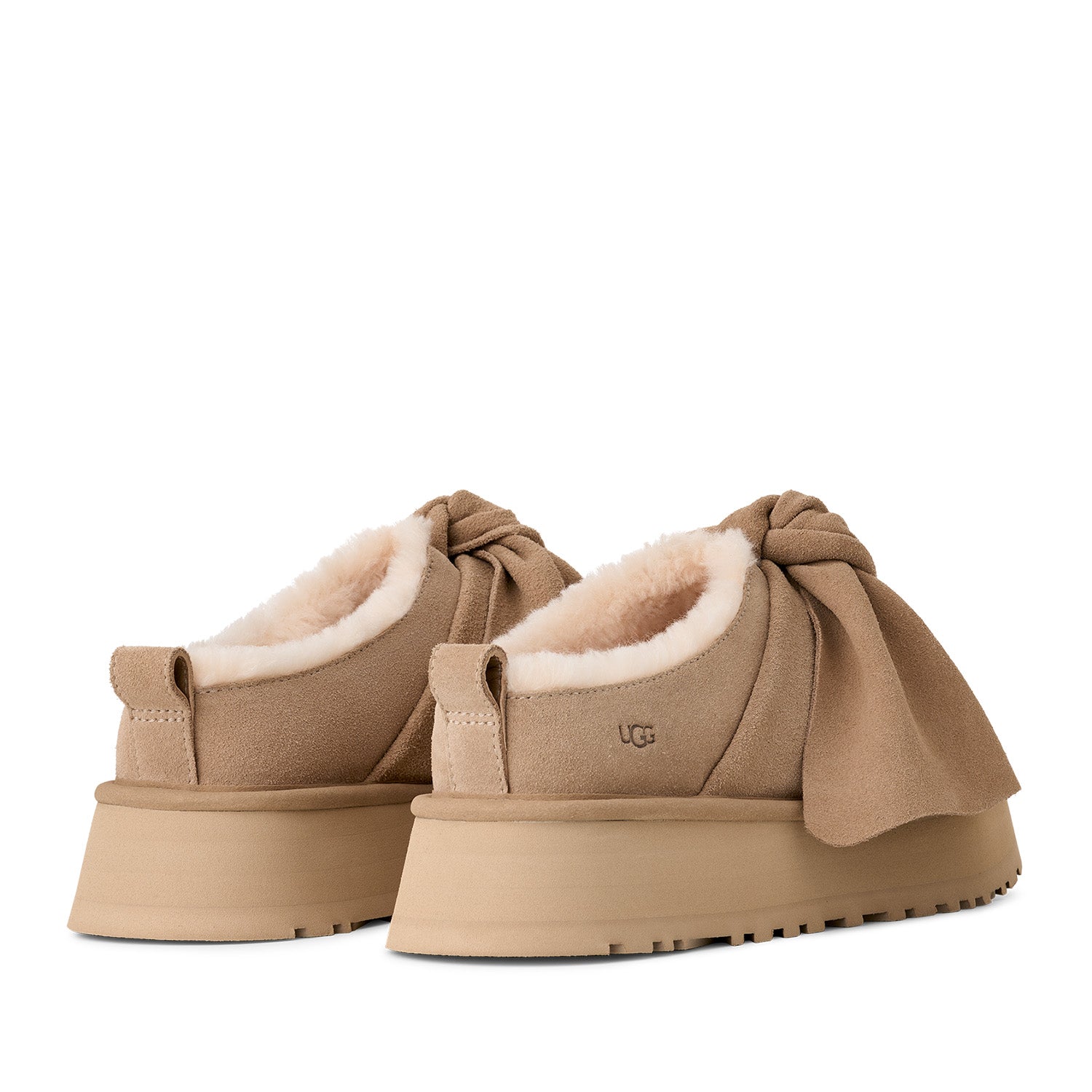 UGG Women's Platform Slip-On Bow in Sand