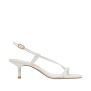 White sandal with thin straps on a white background