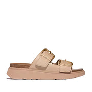Light tan brown leather double strap slide sandal with large gold buckle details on straps. 