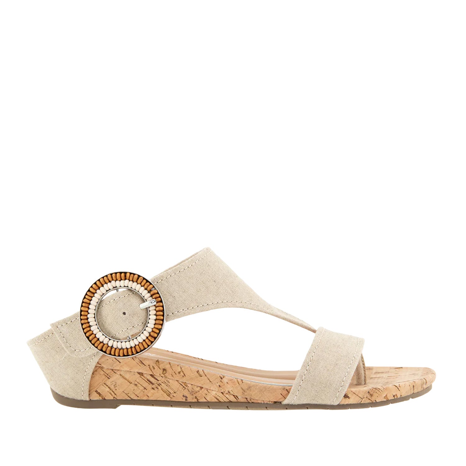 Beige fabric cork wedge toe-post sandal with oversized buckle.