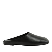 Black slip-on shoe on a white background