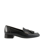 Black leather penny loafer with low heel, and tassle detail. 
